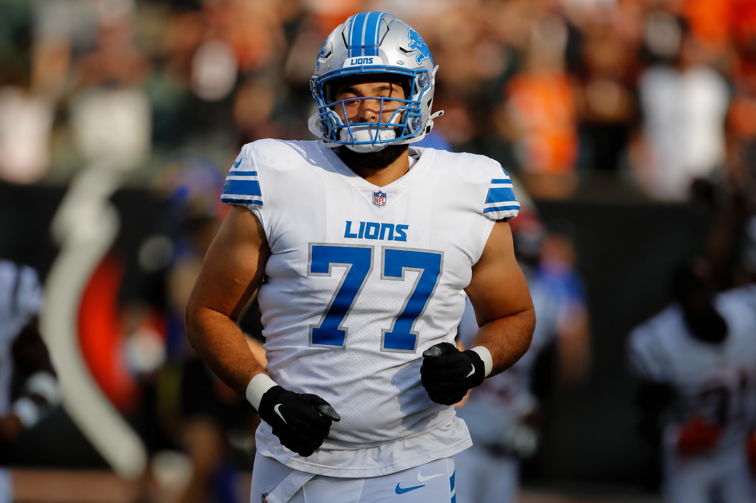 Devin Cochran #77 running onto the field for the Detroit Lions